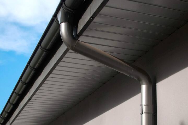 Corrosion-resistant galvanized gutters installed on a commercial building in Greenville